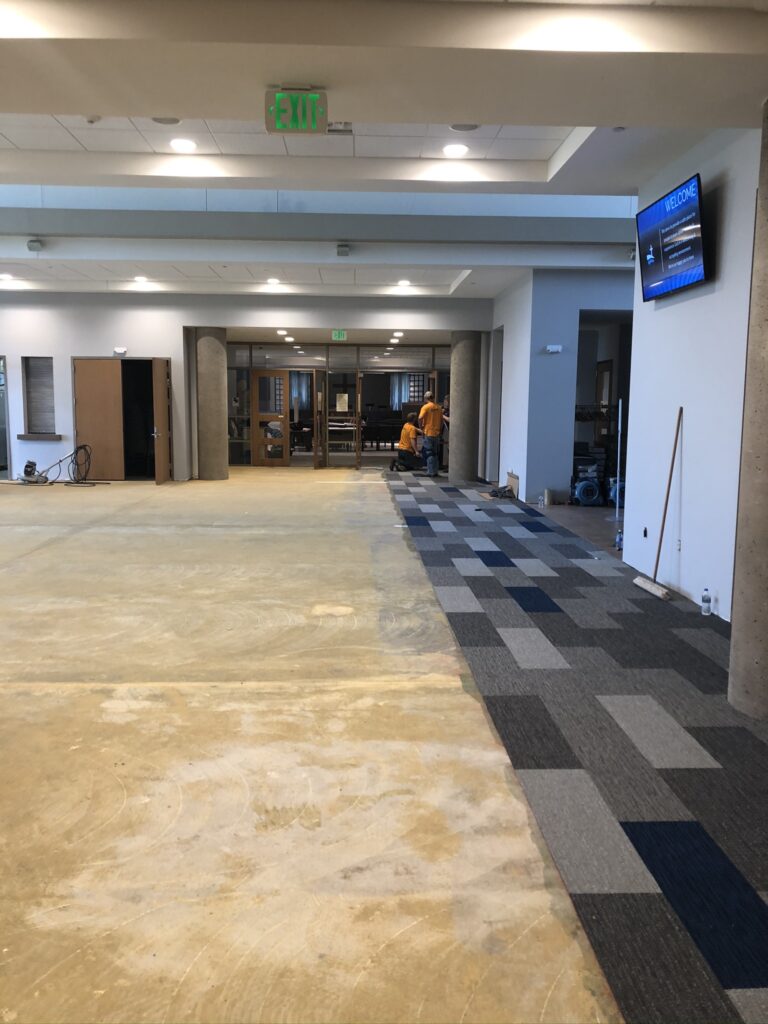 The carpet in the Gathering Space has begun! It will be done by tonight!
